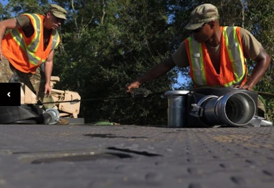 U.S. Army Staff Sgt. Scotty Hill (left) and Staff Sgt. Antonio Epps, with the South Carolina Army National Guard’s Alpha Company, 1st Battalion, 118th Infantry Regiment unload hoses to set up an AquaDam on Highway 17 in Georgetown County, S.C., September 25, 2018. The soldiers are assisting South Carolina Department of Transportation with set up of the AquaDam to keep roads open during the rising waters in the area after Hurricane Florence. About South Carolina National Guard Soldiers and Airmen are currently on duty supporting local authorities in flooded areas. Photo: Capt. Stephen D. Hudson.
