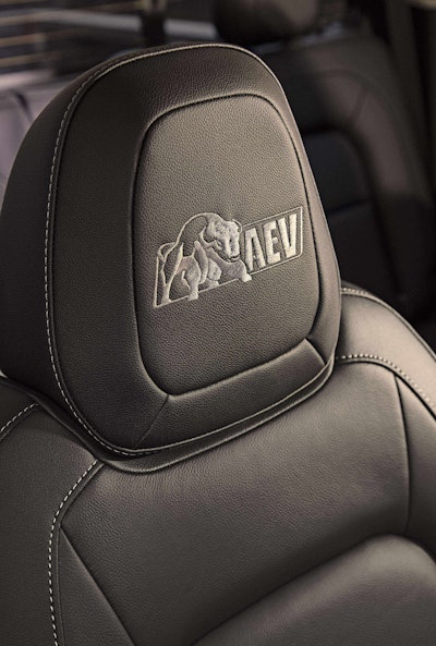Bison features embroidered “AEV” logos on the floor liners and front head restraints.