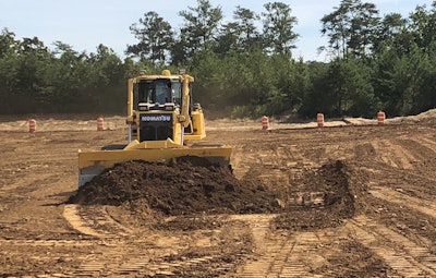 Komatsu Heavy Equipment Pushing Dirt Pile