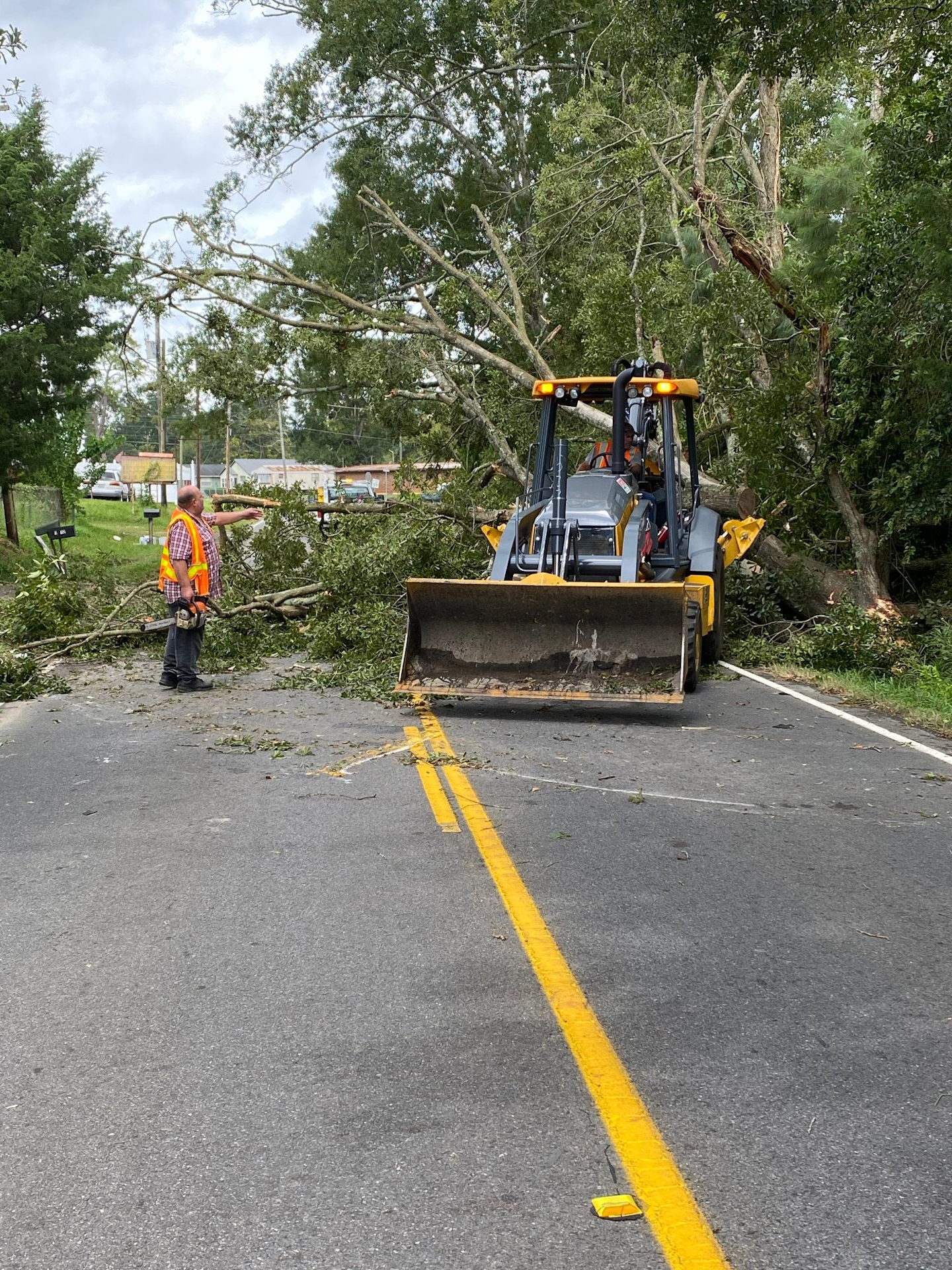Louisiana Department of Transportation and Development crews clean up a blocked road September 3 in Evangeline Parish after Hurricane Laura. Credit: LDOTD