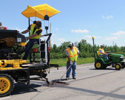 North Dakota transportation workers fill cracks. PHOTO: NDOT.
