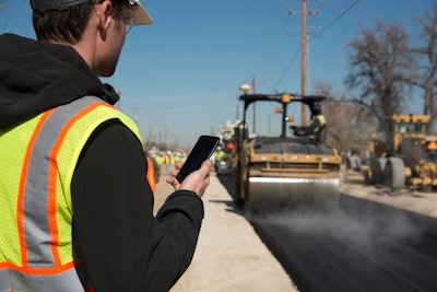 Construction worker using Caterpillar eRoute
