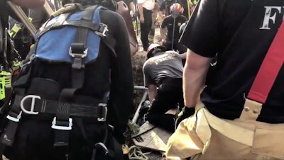 Houston Fire Department personnel dig out by hand a worker trapped in a collapsed trench. Credit: Houston Fire Department