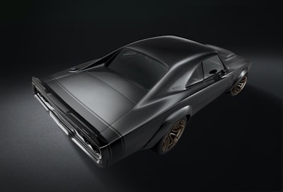The 1968 Dodge “Super Charger” Concept assumes a “wide body” stance thanks to front and rear fiberglass wheel flares painted “De Grigio” Grey Metallic body color. Front wheels push forward two inches to accommodate the flares and shorten the Charger’s overhang, extending the classic’s wheelbase from 117 inches to 119 inches.