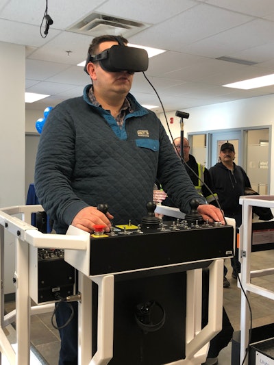 Testing out Serious Labs’ new virtual-reality simulator for operators of mobile elevated work platforms at the opening of United Rentals’ newest training center.