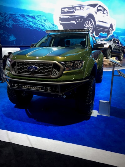 2019 Ford Ranger XLT SuperCrew FX4 by LGE-CTS Motorsports: 2.3-liter I4 EcoBoost engine; 10-speed automatic transmission; Ford Performance powertrain includes cat-back exhaust with Borla black chrome tips; Icon Vehicle Dynamics front suspension with 2.5 Series Remote Reservoir coilovers w/CDC valve, 2.5 Series Remote Reservoir secondary shocks; Billet aluminum upper control arm; Lower A-arm skid plate with secondary shock mount; Icon Vehicle Dynamics rear suspension with 3.0 Series rear bypass shocks; 2.0 Series hydraulic bump stops; custom Icon leaf pack; Icon Alloys 17-inch Rebound wheels; 35-inch BFGoodrich Mud Terrain KM3 tires; Ford Performance by Warn Recovery Kit; spray-in bedliner; Baja Forged by LGE-CTS which includes bed cage with spare tire mount and Pro Eagle jack, fender flares, front bumper with Rigid 20-inch Radiance and two pods, rear bumper with Rigid pods and amber and Rock rail; Rigid Radiance plus 40-inch white backlight roof mounted light bar; PPG Industries Envirobase pain in custom army green glow, bronze and yellow