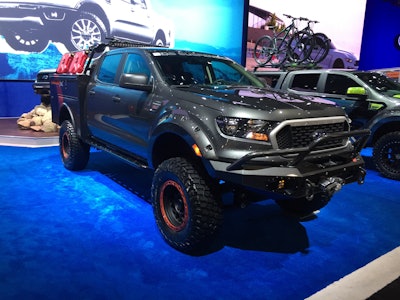 2019 Ford Ranger XLT SuperCrew 4×4 by BDS Suspension: 2.3-liter I4 EcoBoost engine; 10-speed automatic transmission; Ford Performance powertrain includes cat-back exhaust with Borla black chrome tips; custom long bed conversion (136-inch wheelbase); BDS 6-inch suspension lift with BDS upper control arms; Fox 2.5 factory series DSC coilovers; AirLift rear air bag system; rear extended driveshaft; KMC XD Series Grenade OR 17- x 9-inch wheels; BFGoodrich Mud Terrain KM3 (35- x 12.5- x 17-inch) tires; black & fiery orange custom vinyl stripes; Knapheide utility box with custom built rack system; Warn Ascent front bumper; Warn Zeon 10-S winch with Factor 55 FlatLink; Custom Rock Sliders and rear bumper; Rigid LED lighting (Radiance, SR-M and Scene Series); Bushwacker front fender flares; Dometic CFX 40W electric cooler; MaxTrax MKII recovery devices; Rotopax 2.5 gallon FuelpaX containers; Amp Research fuel door; James Baroud retractable awning