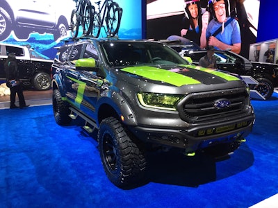 2019 Ford Ranger Lariat SuperCrew 4×4 by A.R.E. Accessories: 2.3-liter I4 EcoBoost engine; 10-speed automatic transmission; Ford Performance powertrain includes cat-back exhaust with Borla black chrome tips; BDS upper control arms; Fox 3-inch leveling kit with off-road shocks; AirLift ride control kit; Black Rhino Mint 22- x 10-inch wheels; Cooper Discoverer STT Pro tires; A.R.E. CX Revo cap and Rival LED lighting; Axalta paint by Lynch Concepts; Buskwacker fender flares; CargoGlide bed tray system; Lizard Skin spray-on insulation; TintWorks window tinting; NFab Epyx side steps; NFab tire carrier; Yakima JetStream roof rack and Highroads bike carriers