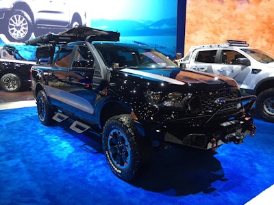Ford Performance reports that its 2019 Ford Ranger Base Camp is ready to go off-road at a moment’s notice. • 2019 Ranger XLT 4×4 SuperCrew • 2.3-liter I4 EcoBoost engine • 10-speed electronic automatic transmission • FX4 Off-Road Package and Sport Appearance Package • 3.73 electronic locking differential Powertrain • Ford Performance cat-back exhaust by Borla, differential cover, skid plates and air intake snorkel Chassis • Ford Performance differential cover and skid plates • BDS Suspension upper control arm kit • Fox three-inch leveling kit with off-road shocks Wheels and Tires • Ford Accessories machined-face black wheels with silver and orange accents, 18 x 8 inches; Ford Accessories wheel lock kit • BFGoodrich All-Terrain KO2 tires, 285/65-18 Exterior • Ford Performance differential cover, skid plates and air intake snorkel • Ford Accessories off-road hoop steps with Tuff-Tone coating, spray-in bed liner, bed mat, bed extender by Lund Motion Products, cargo bed net, keyless entry keypad, TOUCHLINK truck bed light by Lumen and bed rail cargo management system • Ford Accessories by Yakima heavy-duty rack kit by Outpost, SkyRise rooftop tent, eyebolts and load stops, heavy-duty hook straps, recovery track mount, Skinny Warrior roof basket, Slim Shady awning, Quick-click cleats and short bed tracks by SideBar • WARN Ascent front and rear bumpers and Zeon 10k winch • Kay Automotive Graphics KPMF premium air release silver graphics kit Interior Ford Performance by WARN Industries recovery kit includes storage bag, 20-foot by two-inch blue recovery strap rated to 14,400 pounds, winch gloves, ¾-inch D-shackles rated at 18,000 pounds plus instruction manual Ford Accessories all-weather floor liners, console safe by Console Vault and black chrome door sill plates by Putco