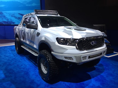 Addictive Desert Design’s 2019 Xbox Ranger’s colors and modern camo pattern were inspired by Xbox Design Lab, a program where gamers can customize their very own Xbox Wireless Controllers. Base vehicle • 2019 Ranger XLT FX4 SuperCrew • 2.3-liter EcoBoost I4 engine • 10-speed automatic transmission Powertrain • Ford Performance by Borla cat-back exhaust, differential cover and rear end differential skid plate kit Chassis • BDS Suspension upper control arms and six-inch lift with Fox coil-over front suspension kit • Fox 2.5-inch coil-over front and rear shocks Wheels and Tires • Custom color-matched Rev 883 wheels, 17 inches • BFGoodrich Mud Terrain KM3 tires, 315/70R-17 Exterior • Addictive Desert Designs Venom R front and rear bumpers, HoneyBadger chase rack with roof rack, tire carrier and Lite side steps • RIGID Radiance series LED lighting and rock lights provide Xbox glow • Xbox Design Studios-themed vinyl wrap Interior • Ford Performance by WARN Industries recovery kit includes 22-foot by two-inch blue recovery strap rated to 14,400 pounds, ¾-inch D-shackle rated to 18,000 pounds, storage bag and winching gloves • Ford Accessories tray-style floor liner • Addictive Desert Designs custom Xbox mounts • Katzkin custom-embroidered Xbox One X leather interior • Xbox One X game consoles mounted behind rear seats, plus Xbox Design Labs winter forces game controllers • Heavy-duty headrest-mounted screens from Next Base • 42-inch high-definition external screens for outside gaming • Forza Horizon 4 loaded in Xbox One X consoles