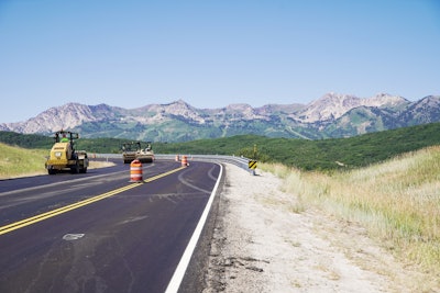Heavy equipment being used to pave a road in Utah