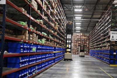 Workers select parts in Doosan’s new parts distribution center in Suwanee, Georgia.