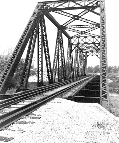 A photo of the once intact railroad bridge over the Grand Calumet River in Lake County, Indiana. Credit: Indiana State Historic Architectural and Archaeological Research Database