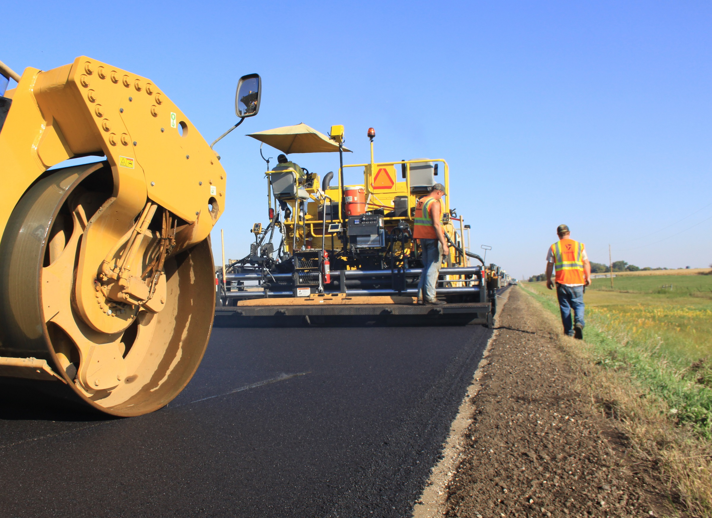 Paver-roller_release BOMAG road crew stock roadbuilding work zone