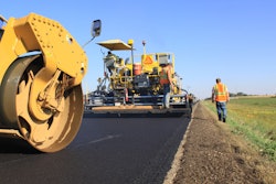 Paver-roller_release BOMAG road crew stock roadbuilding work zone