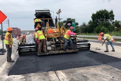 Road crew paving asphalt road work