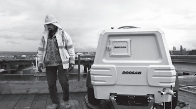 Construction worker with Doosan equipment