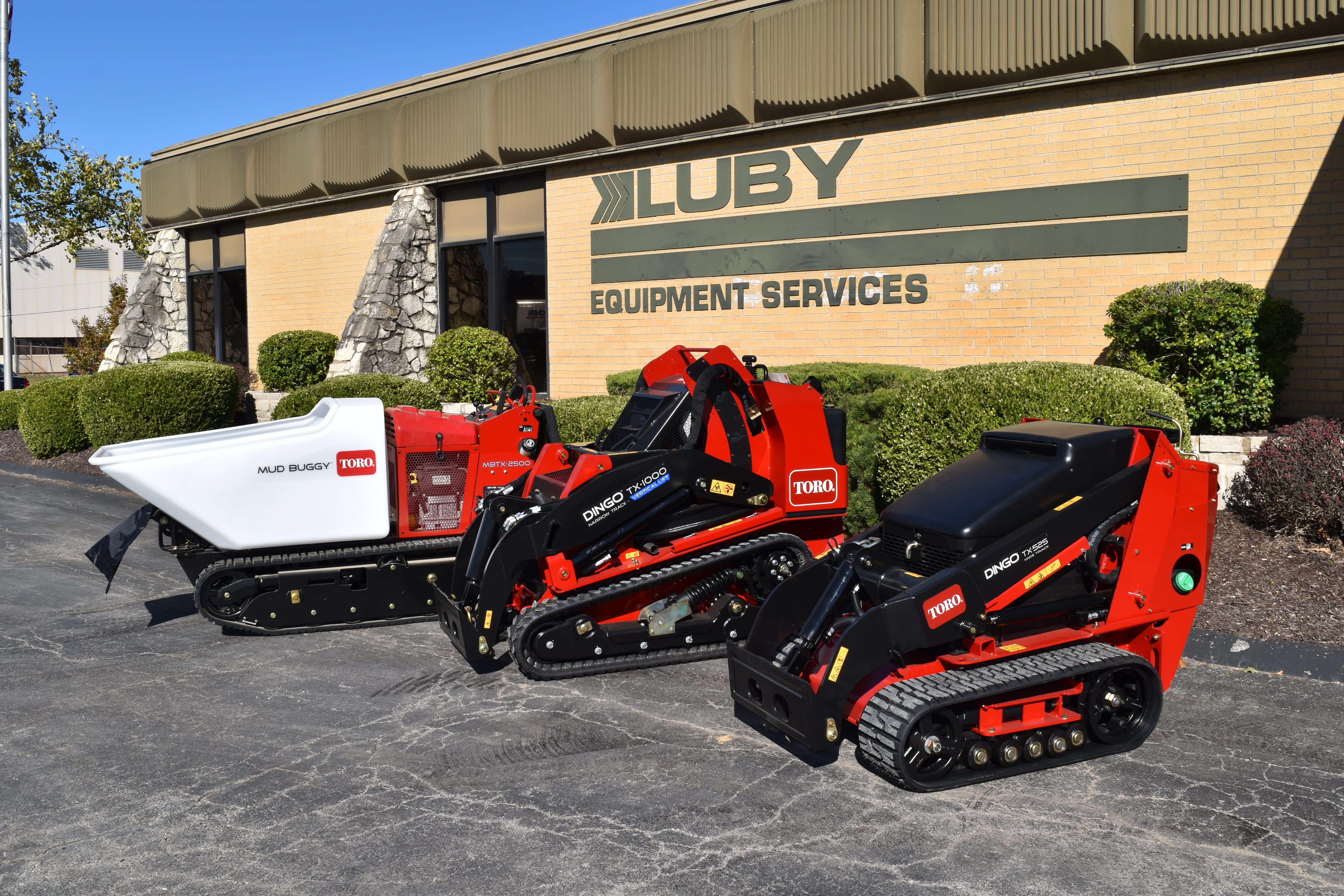 Luby Equipment Services building with Toro equipment in a row