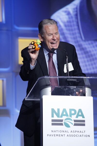 Retiring NAPA President Mike Acott addresses about 950 attendees at the association’s 64th annual meeting. He joked that he had just confiscated this ready-mix concrete toy truck from his grandson and wasn’t giving it back. PHOTO: Gary Fong/Genesis Photos
