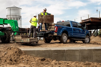 Ford Pickup Being Loaded with Construction Material