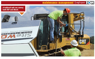 Construction workers fueling a piece of CAT equipment