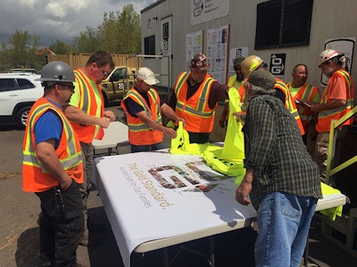 Members of the O&G Newington Route 175 Bridge project sign a safety banner during the companies 2018 Safety Week. Photo courtesy O&G Industries.