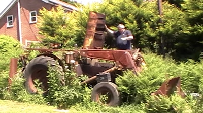 Guy starts up 60-year-old JCB backhoe