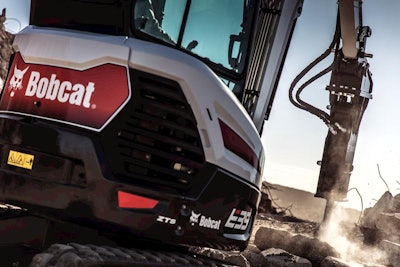 Bobcat and breaker attachment doing demo job