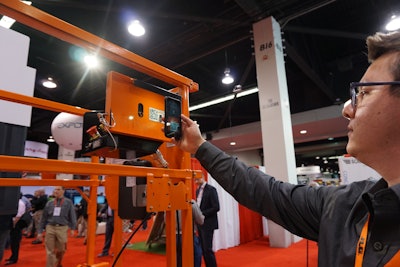 JLG’s Rafael Nunez demonstrates reading the QR code off an R Series lift in preparation to using the Mobile Control app.