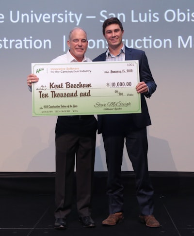Kent Beecham, right, receives a $10,000 scholarship check from HCSS President Steve McGough at the HCSS User’s Group Meeting after being named the Construction Intern of the Year.