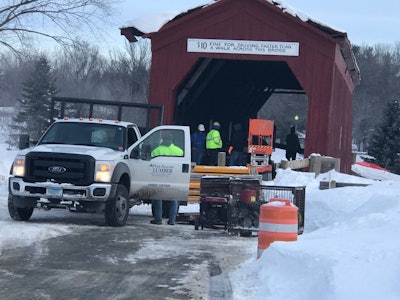 Crews shore up the collapsed roof of the Zumbrota covered bridge. Photo courtesy City of Zumbrota.