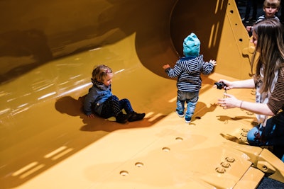 kids in machinery bucket