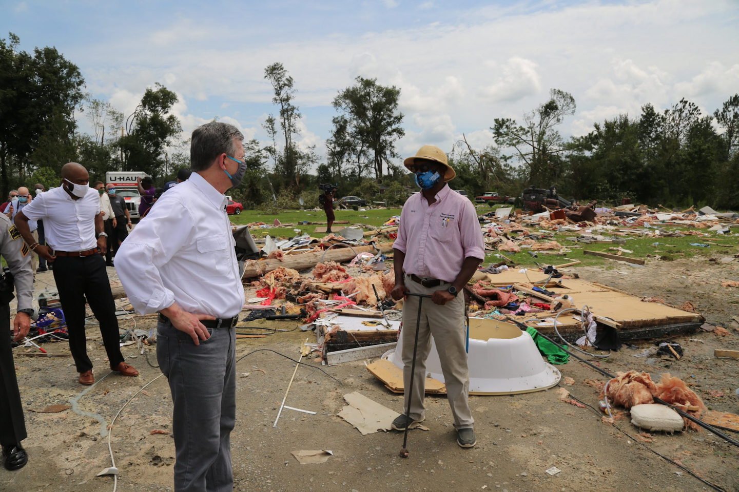 N.C. Gov. Roy Cooper surveys damage August 5 in Bertie County from a tornado spawned from Hurricane Isaias.