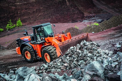 Hitachi ZW550-6 wheel loader moving rocks