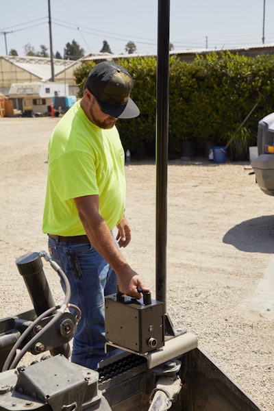 The brain of the system is the EarthworksGo Box, which mounts to the frame of the grading attachment and connects to the laser receivers via cables.