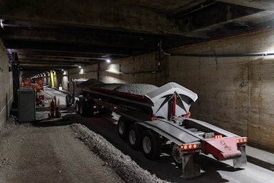Crews truck in concrete rubble from the Alaskan Way Viaduct demolition to fill the decommissioned Battery Street Tunnel in Seattle. Photo courtesy of WSDOT.
