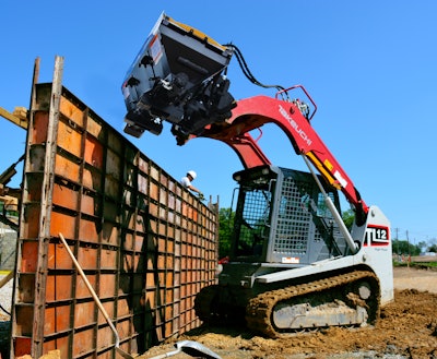 Danuser Mega Mixer bucket attached to a Takeuchi compact track loader
