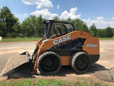case SV340 skid steer with bucket full of gravel
