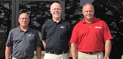 From left, White Oak’s Mark McCarty and Tom Ficklin with McClung-Logan’s Darrin Brown.