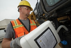 Pouring DEF — Diesel Exhaust Fluid into equipment