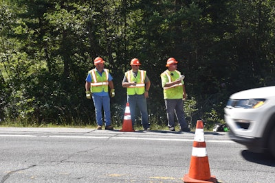 The middle worker in this photo is actually a New State Police trooper enforcing work zone safety. Credit: New York State Police