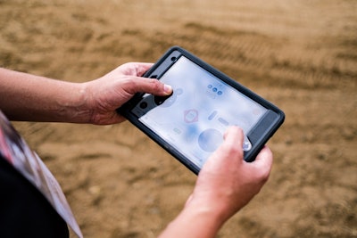 Bobcat’s MaxControl app in use while operating a compact skid steer with an iPad Mini.