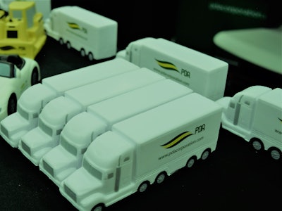 Property Damage Appraisers’ booth at GATS two weeks back featured these stress-relief, squeezable tractor-trailer units, representing the sizable amount of appraisal work done by the company, with well more than 200 franchise damage-appraisal locations throughout the states.