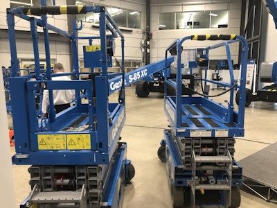 On the left, Genie’s GAS 1932 scissor lift is ANSI-compliant with its higher guard rails and swing door, in comparison to the GS 1930 with its chain link entrance and lower rails.