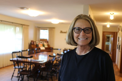 Mary Andringa at the Vermeer family home where she grew up, now the Founders House.