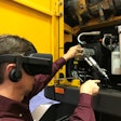 Volvo CE technician with VR glasses