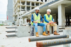 construction workers talking stock
