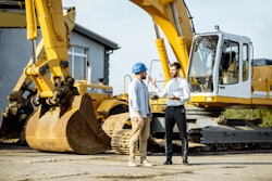 Dealer salesperson with customer shutterstock