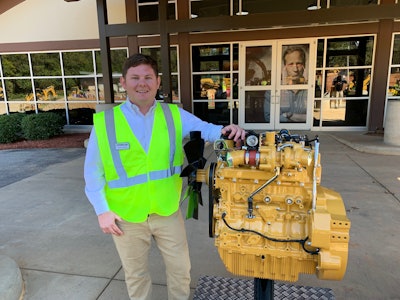 Adrian Hillman and the new Cat C3.6 diesel engine. Photo: Tom Jackson