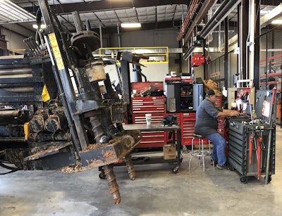 Senior technician Andy Medlin in the service area of the Oklahoma City dealership